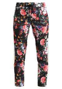 Blommönstrade sweatpants med svart bakgrund, prydda med rosa och gula rosor, elastiskt midjeband, snörning och sidosträck.