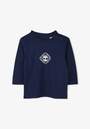 Marineblauwe lange mouw shirt van katoen met een ronde hals en drukknoopdetail. Bevat een wit logo in het midden. Gladde textuur.