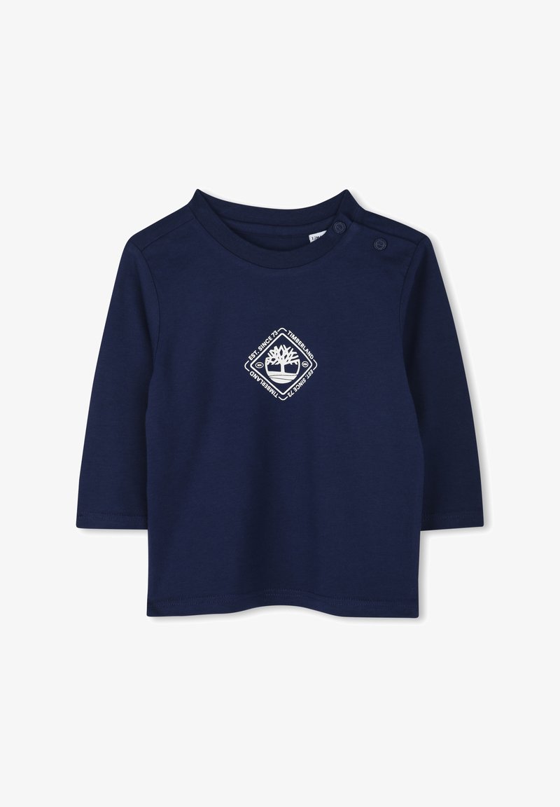 Marineblauwe lange mouw shirt van katoen met een ronde hals en drukknoopdetail. Bevat een wit logo in het midden. Gladde textuur.