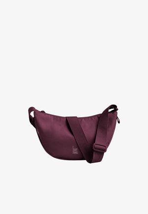 Petit sac bandoulière violet foncé avec sangle large réglable et fermeture éclair, avec le logo "GOT BAG" sur le devant en bas au centre.