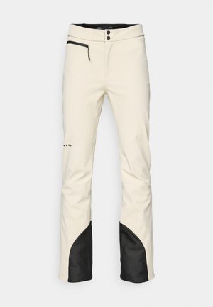 Men's ski pants in cream with a black accent at the hem. Features a zippered pocket, button closure, and tapered legs. Soft, water-resistant material.
