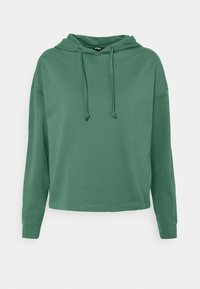 Zelená zkrácená mikina s dlouhými rukávy, stahovacími šňůrkami a volným střihem, vystavená na jednoduchém bílém pozadí.