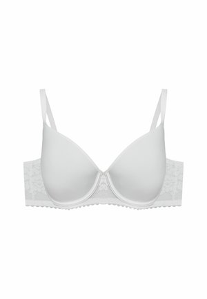 Biały wyściełany biustonosz z gładkimi miseczkami, koronkowym pasem, regulowanymi ramiączkami i falistymi brzegami. Charakteryzuje się prostym wzorem bez zdobień.