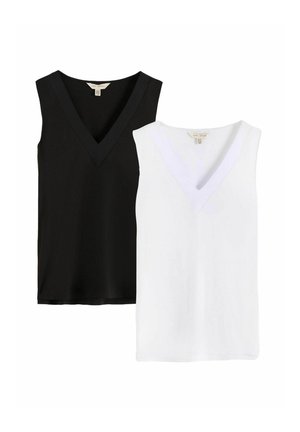Deux hauts sans manches à col en V, un noir et un blanc, posés à plat sur un fond blanc.