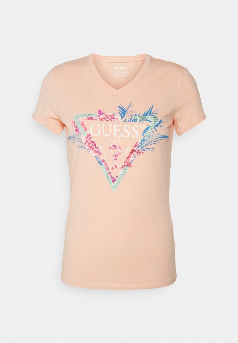 Abrikosfarvet V-hals t-shirt lavet af bomuld, prydet med et blomstret trekantsgrafik i nuancer af pink og teal, med mærket "GUESS" logo.