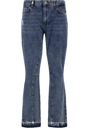 Denimjeans i en falmet blå vask med en cropped flared ben. Har klassisk fem-lommers design og stikninger i kanten for et afslappet look.