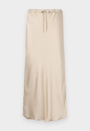 Beige maxi skirt made of soft, crinkled fabric with an elastic waistband and drawstring for adjustable fit. Smooth texture with flowing shape.