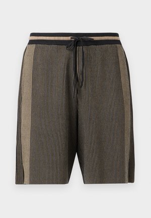 Strikkede shorts til knelengde med vertikale svarte og beige striper, elastisk midjebånd og svart snøring foran.