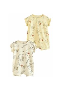 Deux combinaisons à manches courtes, jaune clair. L'une présente des motifs répétés de Winnie l'Ourson ; l'autre inclut Winnie, Bourriquet et Tigrou avec des accents.