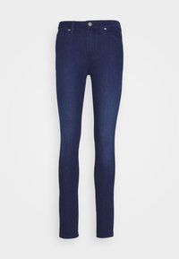 Kapeek jeans tummansinisestä denimistä, joissa on korkea vyötärö, tavanomainen viiden taskun muotoilu ja hillitty ompelu saumoissa.