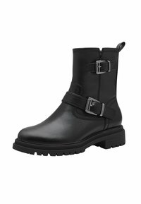 Bottine en cuir noir avec deux boucles en argent, bout rond, tige texturée et semelle en caoutchouc épaisse avec un motif de crampons pour une meilleure adhérence.