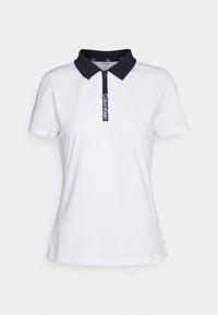 Bílý polo tričko s námořnickým límečkem a zipovým zapínáním. Na zapínání se nachází logo Calvin Klein. Krátké rukávy a měkká struktura látky.