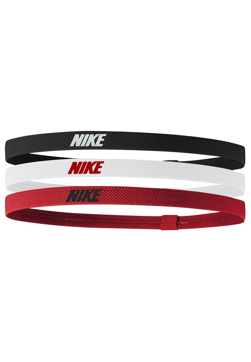 Tre Nike pandebånd: ét sort med hvidt logo, ét hvidt med rødt logo og ét rødt med sort logo; alle har en vævet struktur.