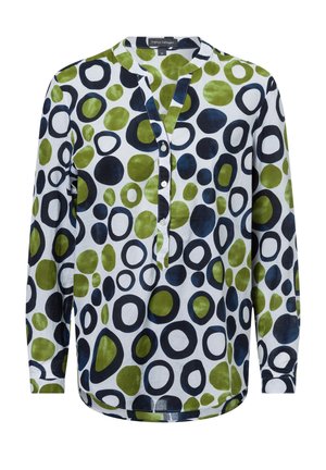 Camicia a maniche lunghe in tessuto bianco con un motivo di cerchi verdi, blu e neri. Colletto a punte con pattina dei bottoni.