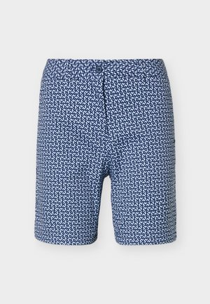 Σκούρα μπλε σορτς με λευκό γεωμετρικό ζιγκ-ζαγκ σχέδιο, κλείσιμο με κουμπί και θηλιές για ζώνη.