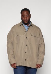 Calvin Klein Könnyű dzseki - brindle