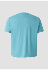 T-shirt bleu clair uni à manches courtes, présenté de dos sur un fond neutre.