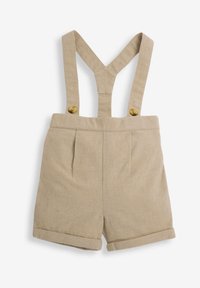 Beige linnedragter med justerbare seler, med en foldet kant og to frontplisser. Gyldne knapper fremhæver stropperne.