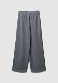 Pantalon ample gris, en tissu texturé, avec taille élastique et sans fermetures visibles. Design épuré avec une finition lisse.