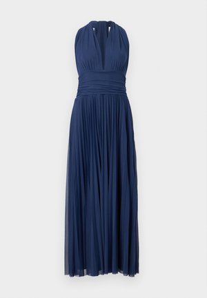 Navy blue halter neck evening gown with pleated skirt and ruched waistband, floor-length with deep V neckline.