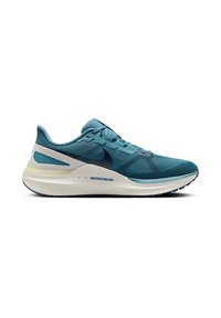 Des chaussures de sport teal avec une tige en mesh texturé, des accents foncés contrastants, un col rembourré et une semelle intermédiaire blanche rembourrée.