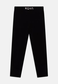 Schwarze Leggings aus elastischem Stoff, mit glatter Textur und einem aufgenähten KORS-Logo am Bund. Keine Taschen oder Muster.