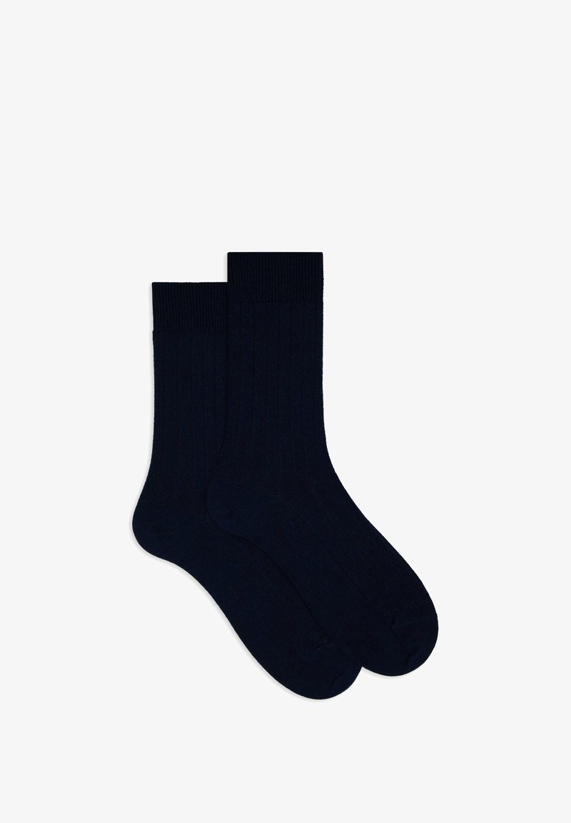 Navy ribbed socks made of a soft fabric, featuring a textured design, reinforced toe, and a comfortable cuff for fit.