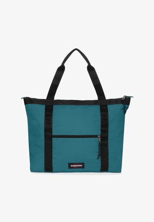 Bolso tote azul verdoso con asas y cremallera negras, bolsillo con cremallera en la parte frontal y parche del logo de Eastpak centrado en la parte inferior.
