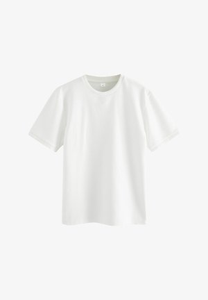 T-shirt bianco a maniche corte con un motivo a nido d'ape testurizzato. Caratterizzato da un collo rotondo e orli a costine. Finitura in tessuto liscia.