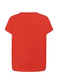 T-shirt en coton rouge à manches courtes, col rond et coupe droite. Texture lisse, couleur unie, sans motifs ni embellissements.