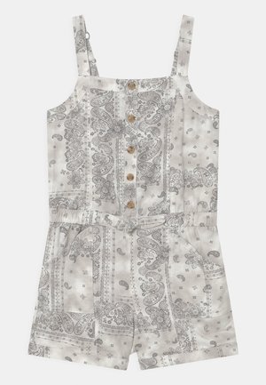 Combinaison courte blanche en coton avec imprimé paisley gris, boutonnage devant, bretelles réglables, taille élastique et poches à l'avant.