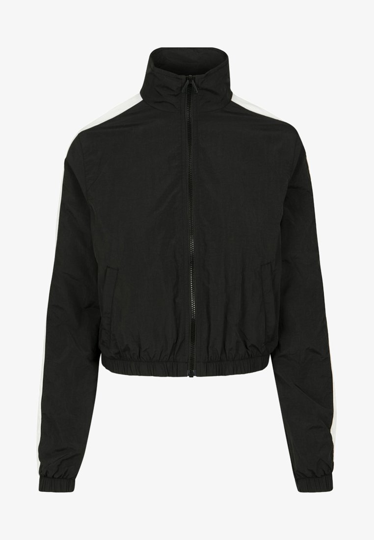 Black cropped jacket with a high collar, front zipper, elastic waistband, and white side stripes. Made of lightweight, smooth fabric.