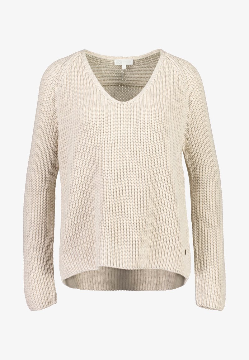 Jasnobeżowy dzianinowy sweter z dekoltem w serek, prążkowaną teksturą, długimi rękawami i lekko zaokrąglonym dołem. Posiada małe logo.