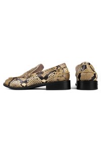 Snake-print loafers in tan and black, crafted from leather. Rounded toe and low black heel with textured pattern throughout.