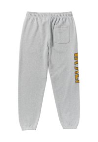Pantaloni della tuta grigi realizzati in tessuto morbido, con vita elasticizzata, polsini affusolati e una tasca laterale. Design grafico giallo sulla gamba sinistra.