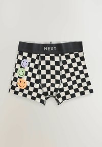 Boxer shorts a scacchi bianchi e neri con un elastico nero che presenta il marchio "NEXT". Tre faccine colorate sul lato sinistro.