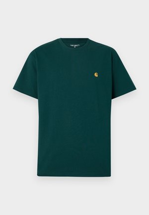 Green cotton t-shirt with short sleeves, round neckline, and a small yellow logo on the chest. Smooth texture and plain design.