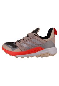 Lightweight trail running shoe with a mesh upper, gray and peach tones, textured midsole, and orange accents; features a pull tab at the heel.