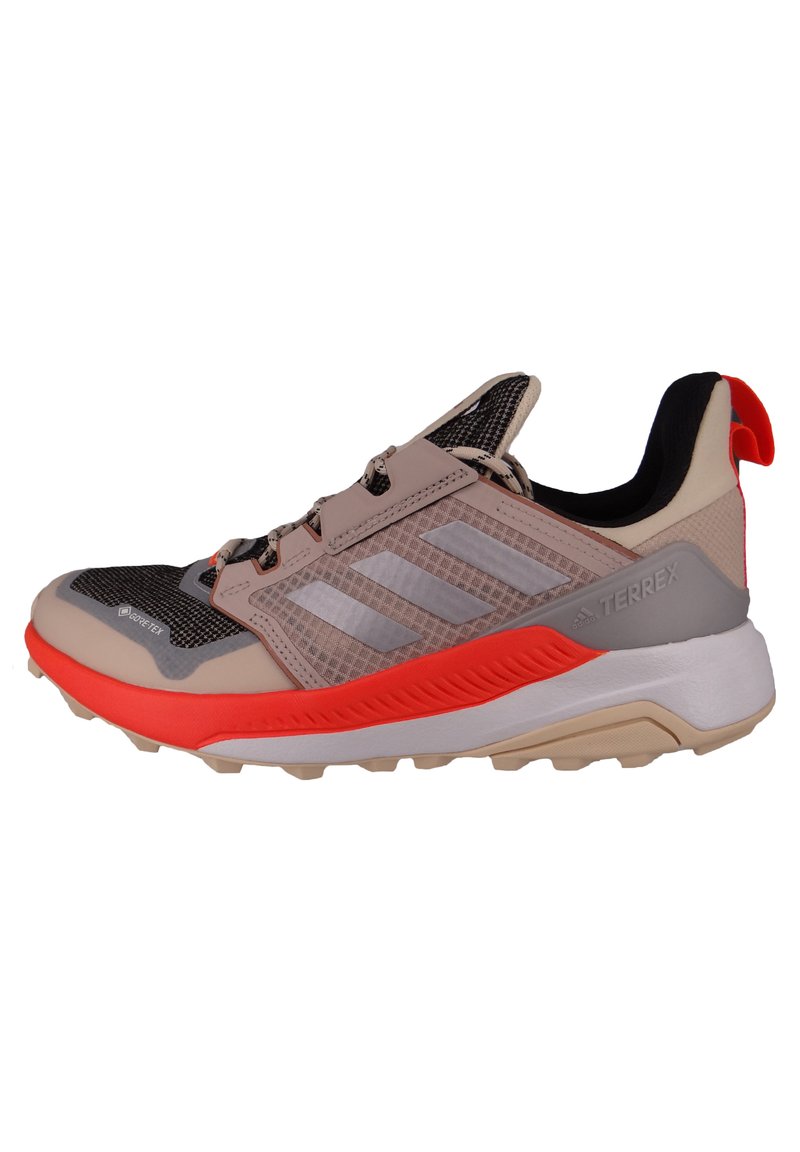 Lightweight trail running shoe with a mesh upper, gray and peach tones, textured midsole, and orange accents; features a pull tab at the heel.