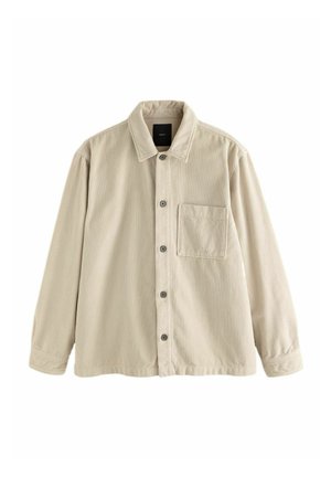 Beige Cordura-Hemd mit langen Ärmeln, Kragen und einer einzelnen Brusttasche auf der linken Seite.