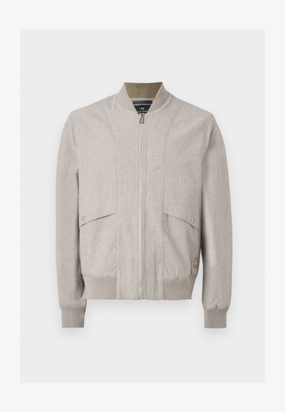 Veste bomber beige clair avec fermeture éclair à l'avant, col, poignets et bas côtelés, et deux poches à rabat pressionnées sur le devant.