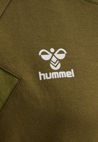 Olive green sweatshirt featuring a textured fabric with a white logo of a stylized bee and the word "hummel" below it.