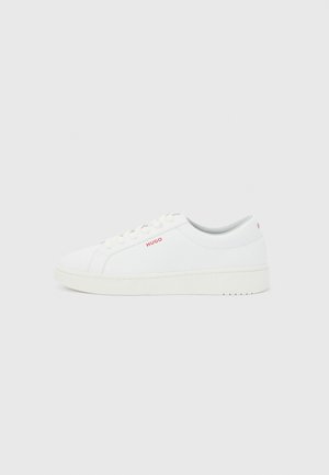 White low-top sneaker with white laces, thick sole, and small red "HUGO" logo on the side and back heel.