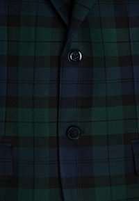 Grüner und marineblauer kariertes Blazer mit Zweiknopfverschluss, Reverskragen und Fronttaschen. Strukturierter Stoff mit einem festen Design.