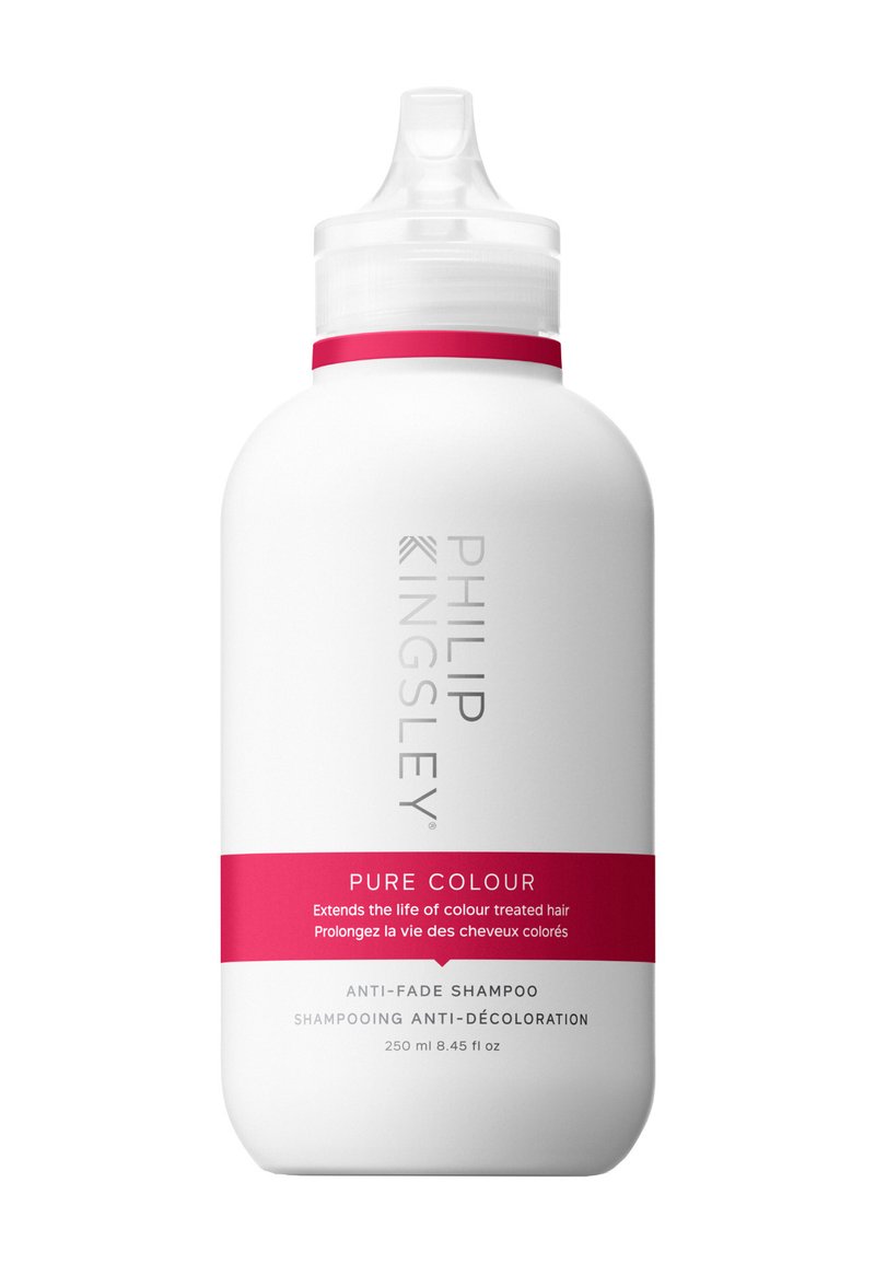 Weiße Kunststoffflasche mit geschwungener Form, versehen mit einem weißen Deckel und einem rosa Akzentband. Das Etikett zeigt "Philip Kingsley Pure Colour" und Verwendungshinweise.