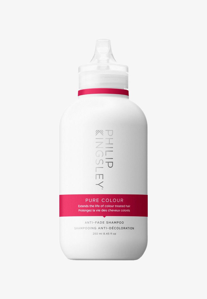 Weiße Kunststoffflasche mit geschwungener Form, versehen mit einem weißen Deckel und einem rosa Akzentband. Das Etikett zeigt "Philip Kingsley Pure Colour" und Verwendungshinweise.