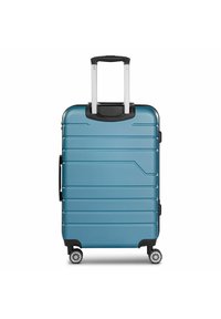 Harde koffer in teal met verticale ribbels, telescopische handgreep en vier wielen. Bevat een zwart accent aan de bovenkant voor grip.