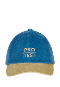 Blauwe corduroy pet met een beige corduroy klep. Voorzien van geborduurde tekst "PRO TEST" in lichtbeige aan de voorkant.