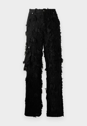 Schwarze Hose mit strukturiertem Fransen-Design. Mit hohem Bund, fünf Taschen und einem seitlichen Riemen mit Schnallenbeschlag. Dehnbares Material.