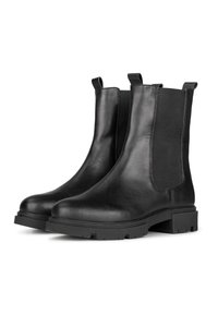 Botas de tobillo de cuero negro con paneles laterales elásticos y tiradores. Cuentan con una suela de goma gruesa con un diseño texturizado para mayor tracción.